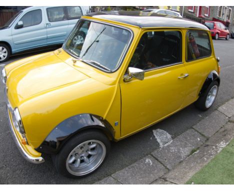 Finished in gleaming Inca Yellow, this tastefully customised Mini Mayfair is a veritable ray of sunshine.Purchased by our ven