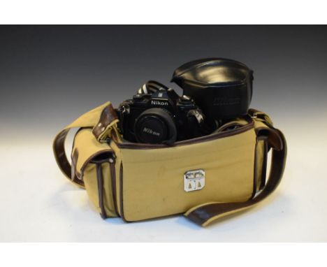 Nikon EM camera with accessories and carry bag  