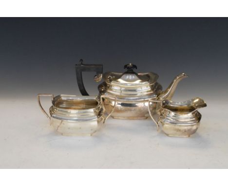 George VI silver three piece tea service comprising: teapot, two handled sugar basin and milk jug, each with reeded handle an