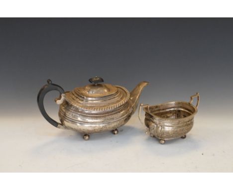 George V silver teapot and two-handled sugar basin, each with gadrooned rim on four ball feet, Sheffield 1927 (teapot) and Lo