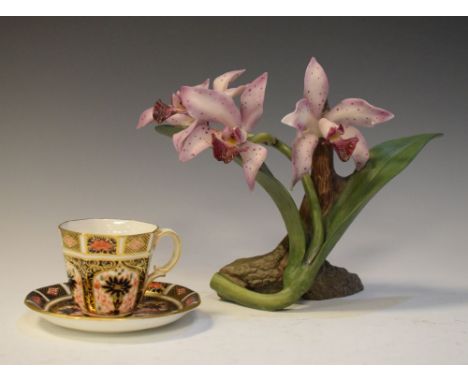 Royal Crown Derby coffee cup and saucer in Imari pattern, together with a porcelain flower study by Ronald Van Ruyckevelt 'Th