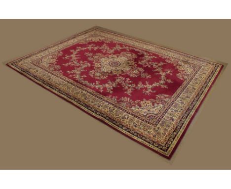 Large machine-made wool rug or carpet, the dark red field with central medallion and allover flowers and foliage within cream