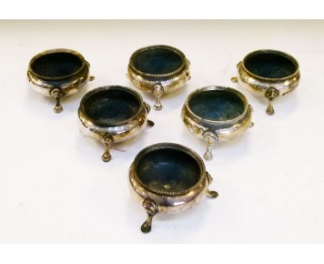 Six late Victorian silver salts, each of cauldron form with beaded rim on three hoof feet, four London 1883, all six by RH, 8