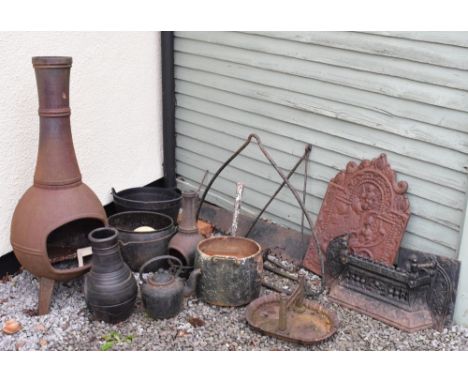 Assorted metal work to include; cast iron fire back, cast iron plaque, fire front, iron cooking pots, garden chiminea, boot s