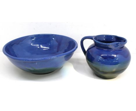 Jug and wash bowl by C H Brannan 'Barum ware' Blue glaze to upper body transitioning to iridescent green glaze at lower body.