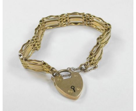 GOLD BRACELET. A Victorian 15ct. gold gate bracelet with padlock clasp. Approx. 26.2g.