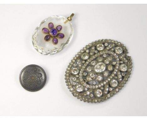 VICTORIAN PENDANT ETC. A Victorian faceted glass &amp; amethyst flower head pendant, length 3.5cm, a paste brooch (a.f.) &amp