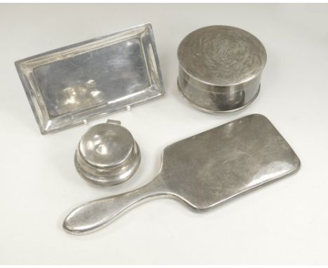 INDIAN SILVER.An Indian silver coloured metal hand mirror, with bevelled plate, two matching boxes & an Indian silver coloure