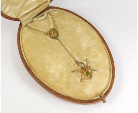 SPIDER &amp; FLY PENDANT. A Victorian 15ct. gold pendant, featuring a fly within a roundel. From this a knife edged bar with 
