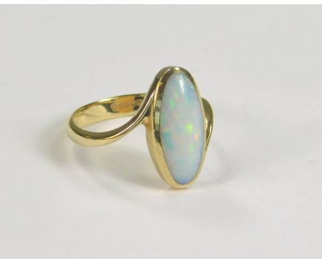 OPAL RING. A 9ct. gold modern ring, set an oval opal. (M)