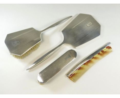 BRUSH SET. An engine turned four piece brush set.