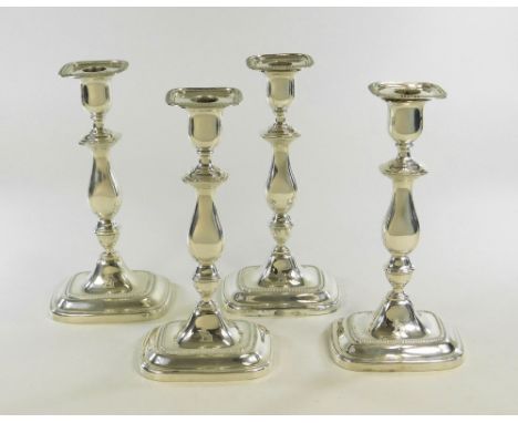 CANDLESTICKS. A set of four 20th century filled silver candlesticks by William Hutton &amp; Sons Ltd. Sheffield 1915. Each wi