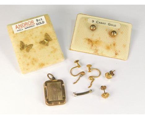 GOLD STUDS ETC. Two pairs of 9ct. gold stud earrings, an engine turned locket, a little scrap gold etc.