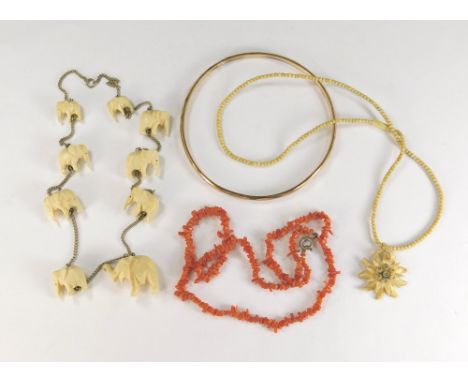 CORAL ETC. A stick coral necklace, two bone necklaces &amp; a rolled gold slave bangle.