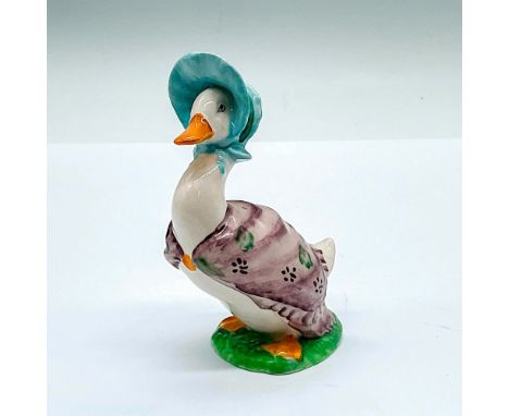 Small porcelain figure of a white duck in a mauve shawl, light blue bonnet, and yellow scarf clip. Beswick Beatrix Potter's b