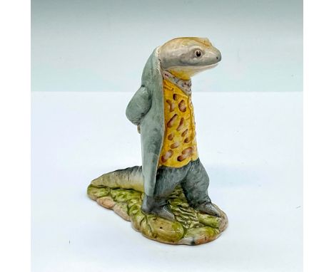 Glazed porcelain figure of a newt in a pale gray jacket and a yellow button vest with brown splotches. Beswick Beatrix Potter