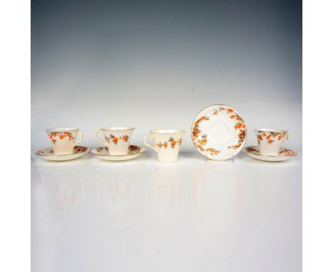A set of 4 teacups and 4 saucers that are painted off white with a tiger lily motif present in each item. Radford's backstamp