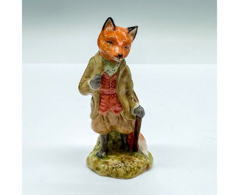 Glazed figure of a fox in a green suit, red waistcoat, and holding a dark brown walking stick. Royal Doulton Beatrix Potter's