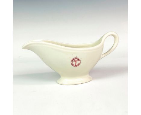 A porcelain gravy boat with handle, stamped with United States Army Medical Department logo. Sterling Printed China stamped t