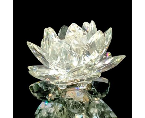Large water lily candlestick holder the attached base sits on three crystal balls. Swarovski backstamp etched into bottom. Is