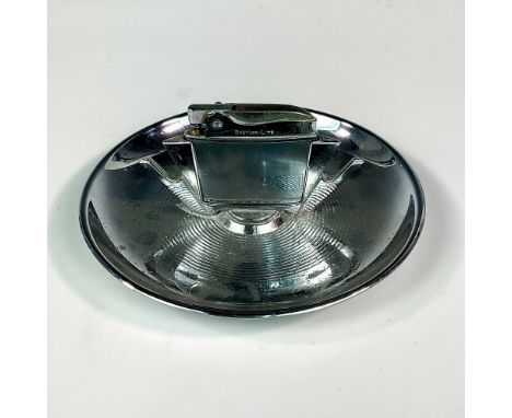 A round silver-tone tray with a built in lighter with cigarettes holders. Diecasters Inc. embossed stamp on the base. Brother