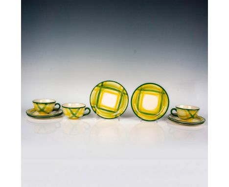A classic set featuring yellow and green plaid-patterned cups, saucers, and lunch plates, crafted by the renowned mid-century