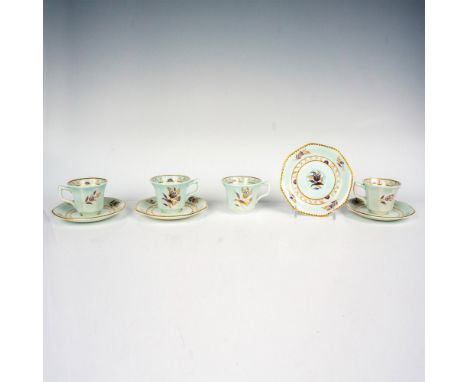 Lovely set of four cups with their saucers with a light green glaze and hand-painted floral motif with gold embellishments. A