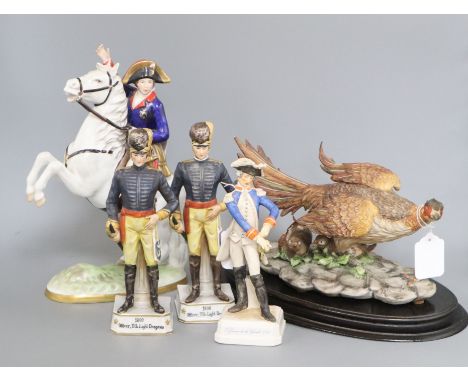 A Capodimonte limited edition model of a pheasant, on oval wood plinth, no. 664/1000 and four military figures, comprising a 