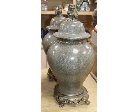 A pair of ceramic faux shagreen lidded vases