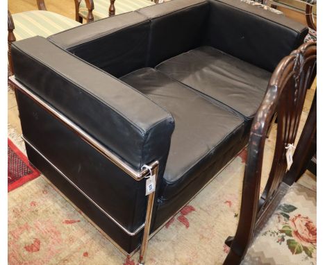 A Corbusier style black leather and chrome two seater sofa W.128cm