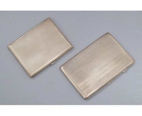 Two engine turned silver cigarette cases, largest 12.8cm.