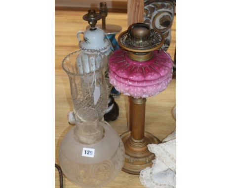 A brass and pink opaline glass oil lamp with etched glass shade and three table lamps, various, including a cut glass pedesta