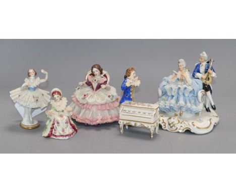 Five Dresden, Irish Dresden and other small lace figures, comprising a group of a couple singing and playing a mandolin, anot