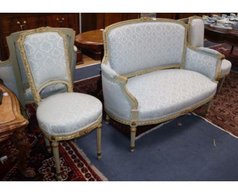 A Louis XVI style five piece salon suite, with carved silvered frames, comprising a sofa, a pair of fauteuil and a pair of bo