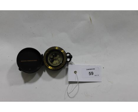 A CAVALRY SCHOOL COMPASS. In the military blackened brass style, maker J H Steward London. 50mm x 25mm.