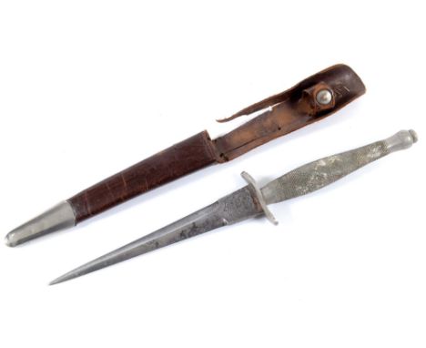 A FIRST PATTERN WILKINSON COMMANDO DAGGER. Marked at the ricasso on one side of the blade blade, Wilkinson Sword Co Ltd Londo