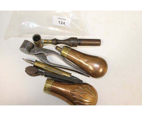 POWDER FLASKS etc Including a plain small pistol flask of copper and brass 4.1/2" long. Another with decoration and lacking i