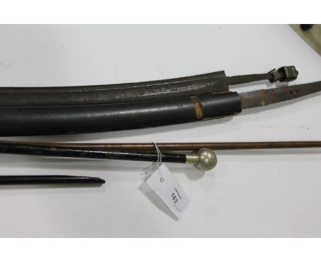 PARTIAL SWORDS etc. A partial 18thC hanger with brass pommel and without a grip being present, having a curved 25.3/4" blade 