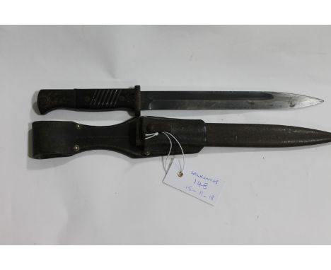 A K98 BAYONET &amp; SCABBARD. A K98 model German bayonet, complete with its steel scabbard and leather frog. Various markings