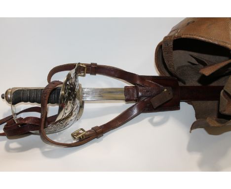 AN OFFICERS SWORD. An 1897 pattern Infantry officers sword, complete with field scabbard and outer carrycase. Plain with no m