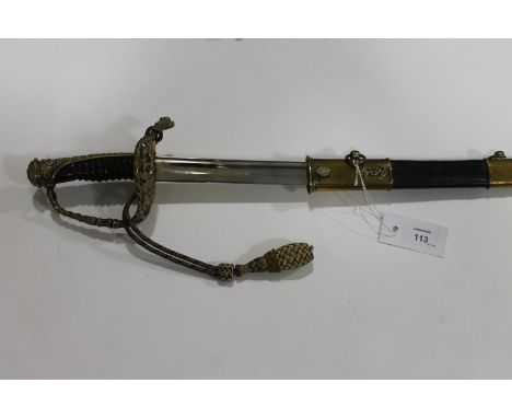 A CONTINENTAL NAVAL OFFICERS SWORD. A continental naval officers sword, with ornate guard and brass and leather scabbard. Mar