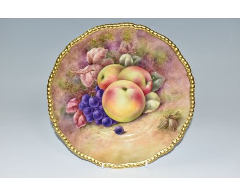 A COALPORT HAND PAINTED CABINET PLATE, with gilt rim, hand painted with apples, grapes and hazel nuts by Richard Budd, signed