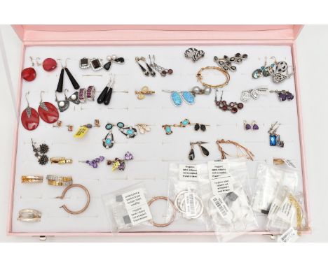 A PINK JEWELLERY DISPLAY BOX WITH EARRINGS, forty eight pairs included, various designs, some pieces set with semi-precious g