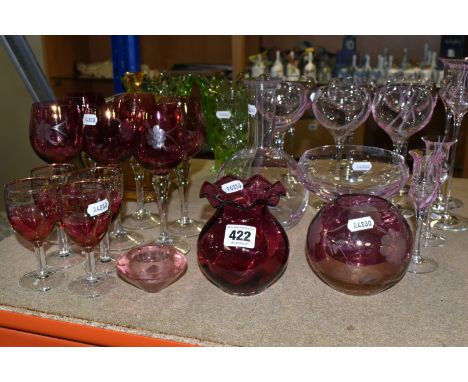 A SELECTION OF COLOURED GLASSWARES, to include six Caithness wine glasses, two tall candlesticks and two small candlesticks, 