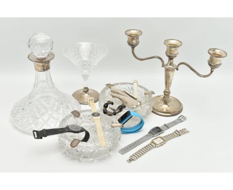 A BOX OF ASSORTED SILVER AND GLASS WARE, to include a silver candle stick, two branches off a tapering stem to a round weight