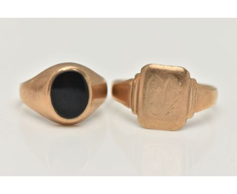 TWO SIGNET RINGS, the first a 9ct gold ring with central oval onyx panel, 9ct hallmark, ring size K, the second of plain desi