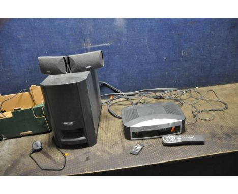 A BOSE AV3-2-1 MEDIA CENTRE with remote, PS3-2-1 powered speaker system including sub interlink cables and two satellite spea