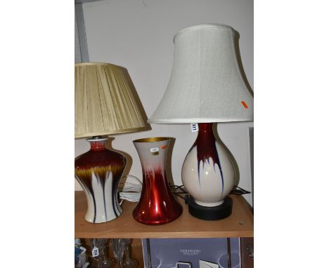 TWO MODERN TABLE LAMPS AND SIMILAR VASE, comprising two modern table lamps with dripped red/red ochre glazes on a white groun