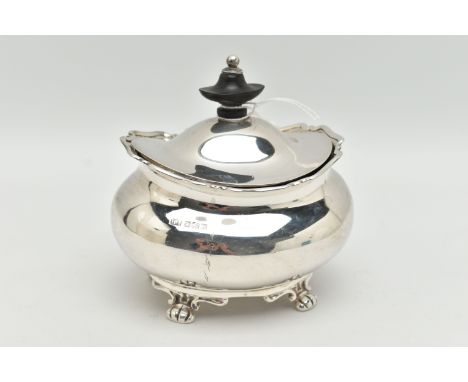A GEORGE V SILVER TEA CADDY OF OVAL FORM, the hinged cover fitted with an ebony finial, on four paw feet, maker Atkin Brother