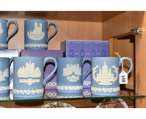 A COLLECTION OF TEN BOXED WEDGWOOD BLUE JASPERWARE CHRISTMAS MUGS, comprising 1971 Piccadilly Circus, 1972 St. Paul's Cathedr